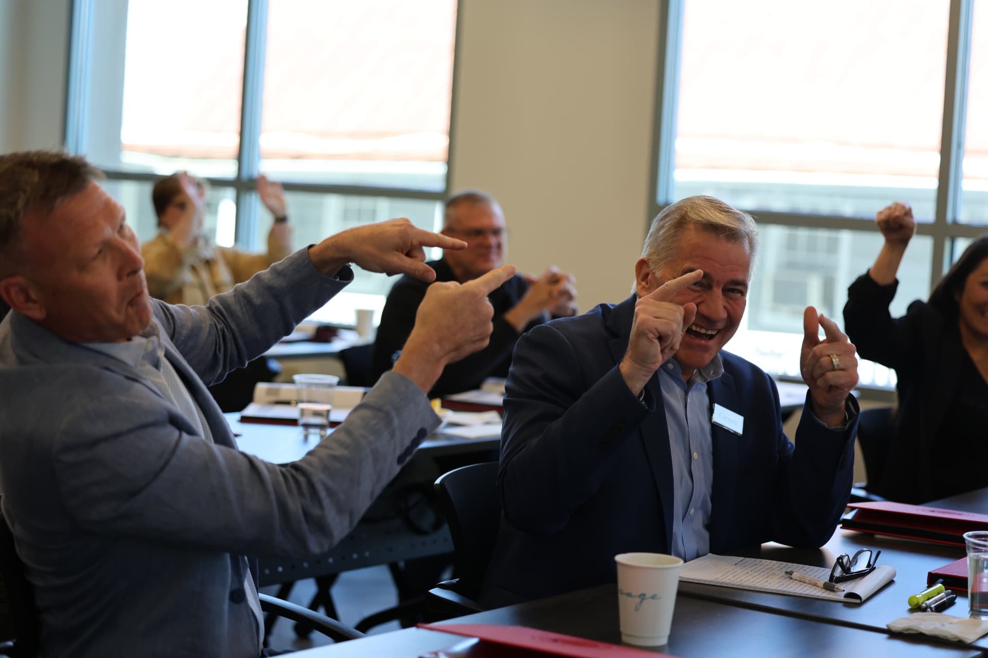Program participants cheering during a live session